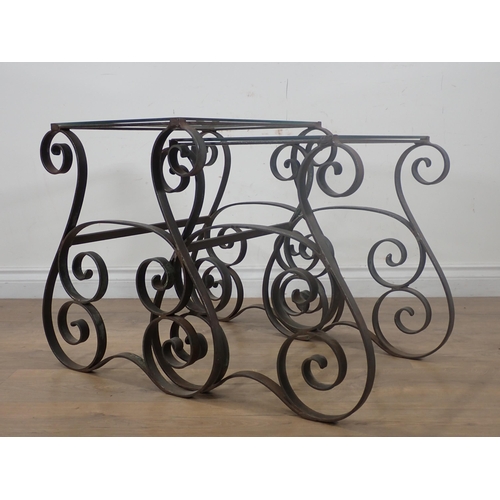 31 - A Nest of two wrought iron glass topped Occasional Tables