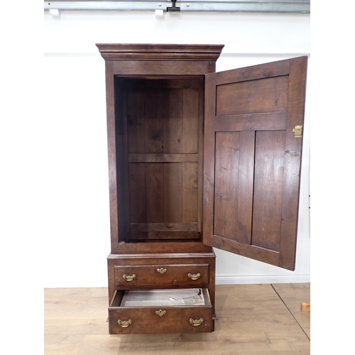 323 - An oak single Wardrobe fitted one real drawer and one dummy drawer to base made by Bylaws 6ft 11in H... 