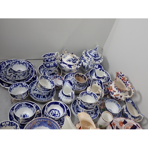 349 - A quantity of 19th Century blue and white Tea Wares, two pottery Jugs, Dog Figure, etc.