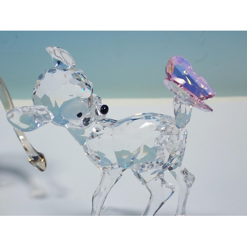 354 - Six boxed Swarovski Animales including Camel, Giraffe, Leopard, two Lions and a Fawn