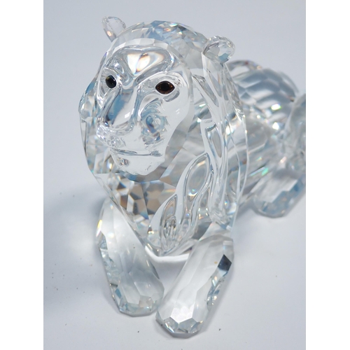 354 - Six boxed Swarovski Animales including Camel, Giraffe, Leopard, two Lions and a Fawn