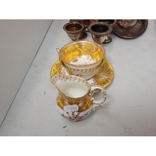 355 - A Royal Worcester yellow ground Cup and Saucer, Tea Cup and Jug with gilt and floral hand painted de... 