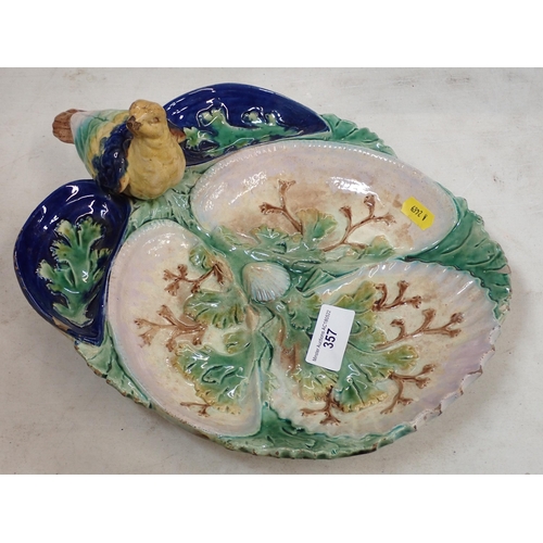 357 - A Majolica style Dish with bird and leafage decorations (Chipped)