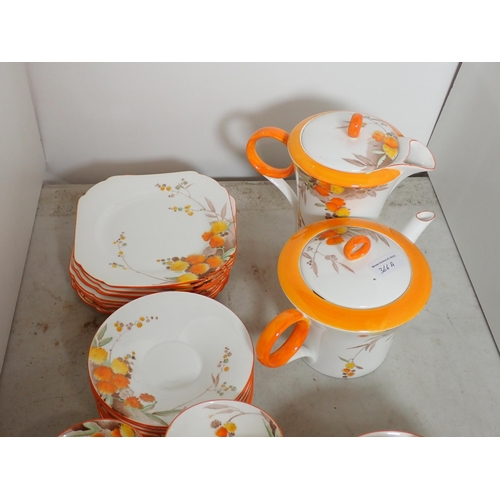 366A - A Shelley part Tea Service decorated floral sprays and orange borders, two cups A/F