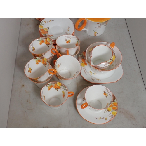 366A - A Shelley part Tea Service decorated floral sprays and orange borders, two cups A/F