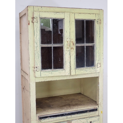 622 - A cream painted Kitchen Cabinet with two door lead glazed upper section above base fitted single dra... 