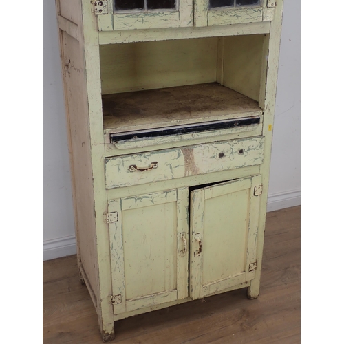 622 - A cream painted Kitchen Cabinet with two door lead glazed upper section above base fitted single dra... 