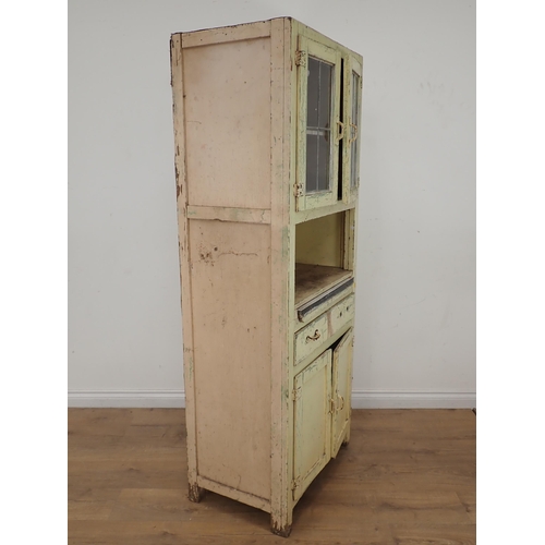 622 - A cream painted Kitchen Cabinet with two door lead glazed upper section above base fitted single dra... 