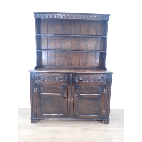 625 - An oak Dresser and Rack fitted two frieze drawers above pair of panelled cupboard doors 6ft H x 4ft ... 