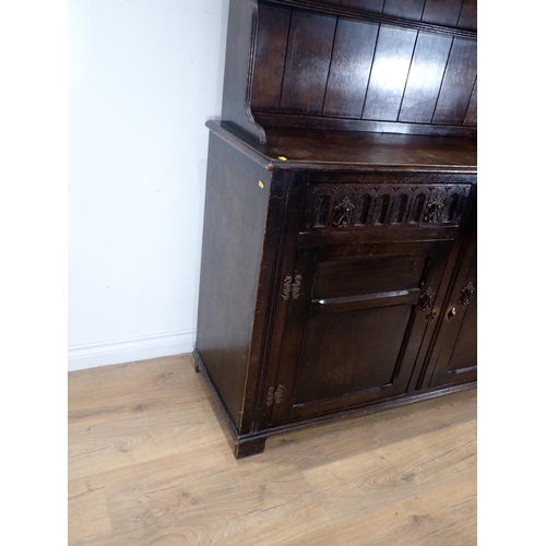 625 - An oak Dresser and Rack fitted two frieze drawers above pair of panelled cupboard doors 6ft H x 4ft ... 