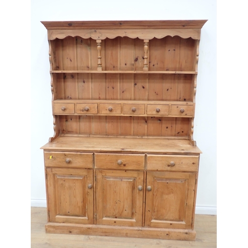 627 - A modern pine Kitchen Dresser and Rack the base fitted three drawers and three cupboard doors 6ft 3i... 