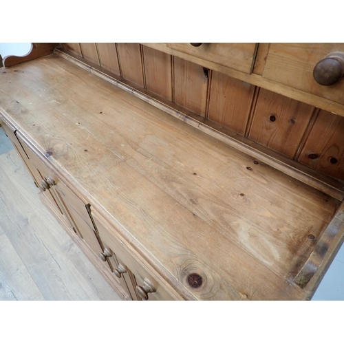 627 - A modern pine Kitchen Dresser and Rack the base fitted three drawers and three cupboard doors 6ft 3i... 