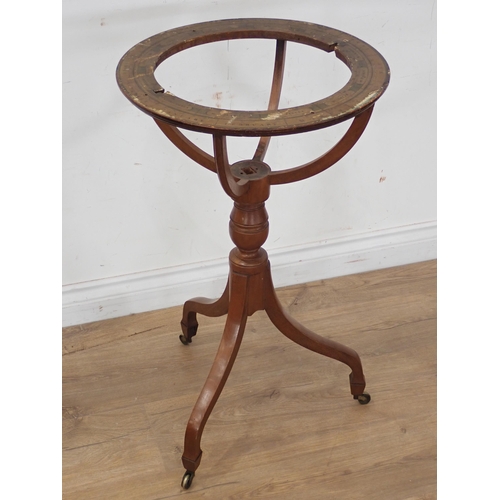 65 - A mahogany Globe Stand on tripod base with casters