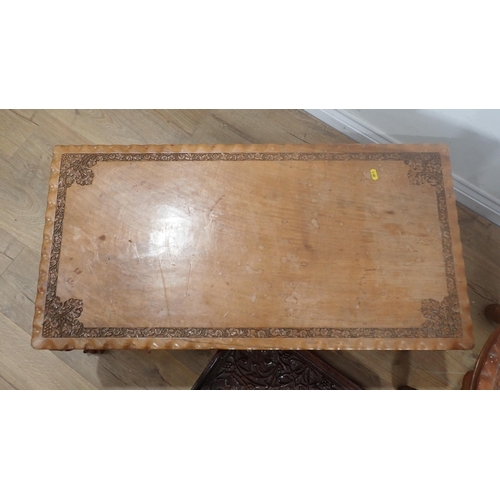 82 - A carved hardwood Coffee Table, a circular Table and a leafage carved Tray