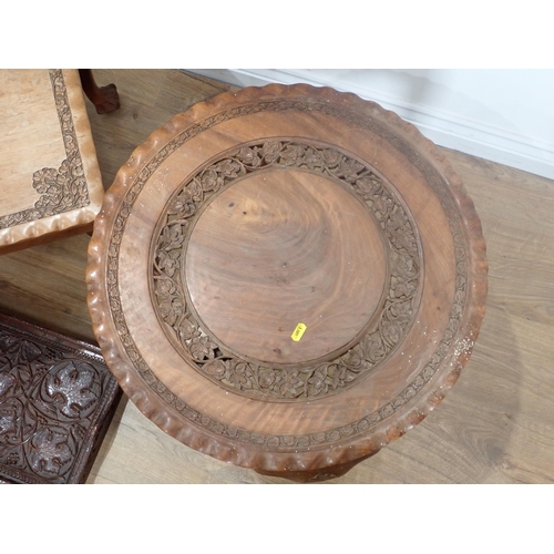 82 - A carved hardwood Coffee Table, a circular Table and a leafage carved Tray