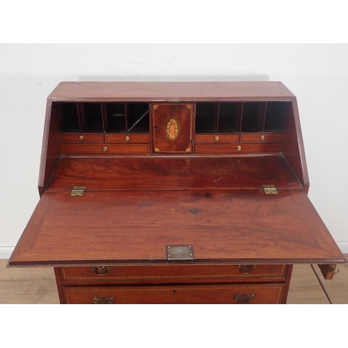 90 - A 19th Century mahogany and inlaid Bureau with fitted interior over four graduated drawers mounted o... 