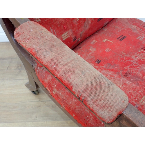 250 - A red upholstered Victorian Armchair on turned front supports and casters (moth damage A/F) and anot... 