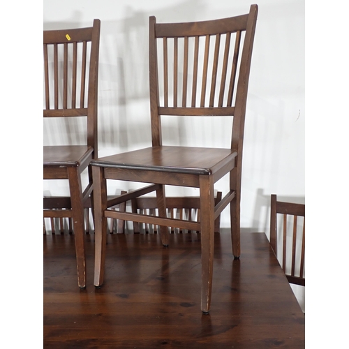 262 - A modern stained pine Dining Table 6ft 5in W x 2ft 6in H and eight Dining Chairs