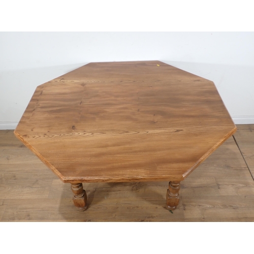 272 - A modern walnut octagonal Dining Table on turned supports 4ft 6in W x 2ft 6in H