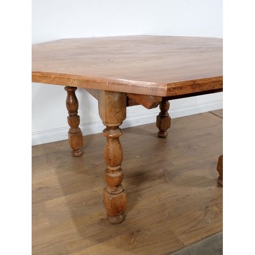 272 - A modern walnut octagonal Dining Table on turned supports 4ft 6in W x 2ft 6in H