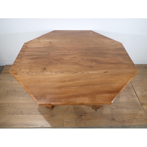 272 - A modern walnut octagonal Dining Table on turned supports 4ft 6in W x 2ft 6in H