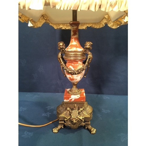 284 - A red Onyx Table Lamp of urn form with Putti and Swag brass decoration mounted on brass base with ar... 