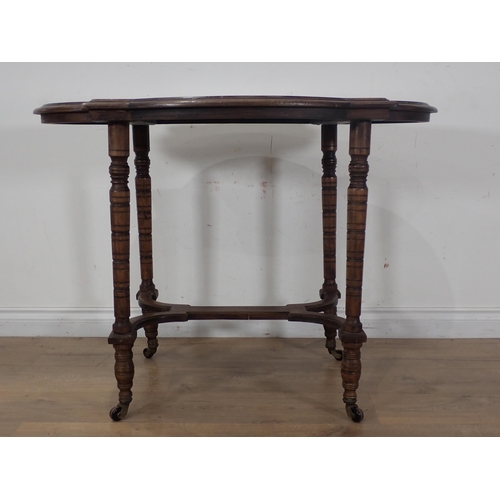 285 - A Victorian walnut Centre Table with shaped top, cross stretcher, on ring turned supports A/F 3ft 3