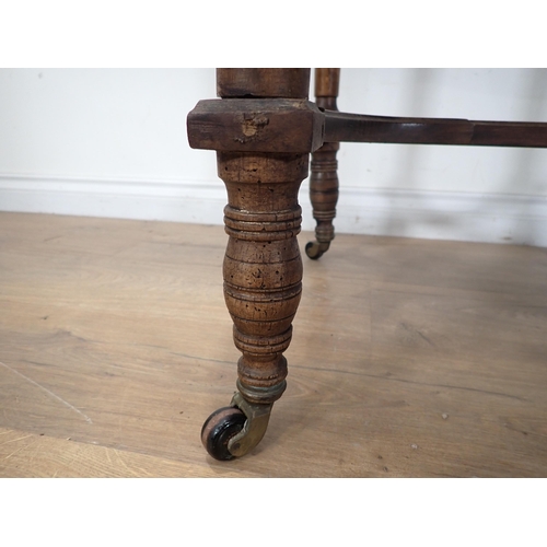 285 - A Victorian walnut Centre Table with shaped top, cross stretcher, on ring turned supports A/F 3ft 3