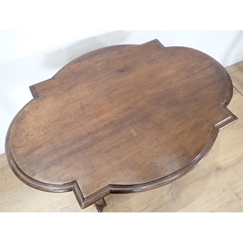 285 - A Victorian walnut Centre Table with shaped top, cross stretcher, on ring turned supports A/F 3ft 3