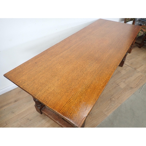 314 - An oak Refectory Dining Table and six oak framed Dining Chairs, the table have carved frieze and rai... 