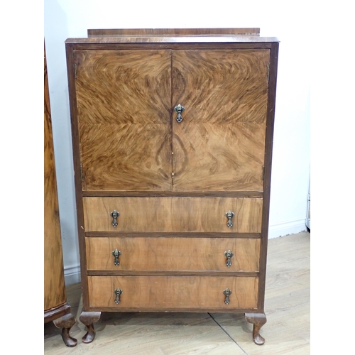 687 - A 20th Century walnut veneered three door Wardrobe 6ft 2in H x 5ft 9in W and a Gentleman's Wardrobe ... 