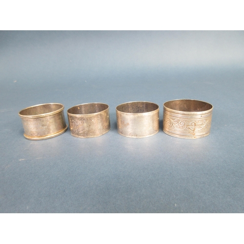 116 - A pair of plain silver circular Napkin Rings, Birmingham 1962 and two other silver Napkin Rings