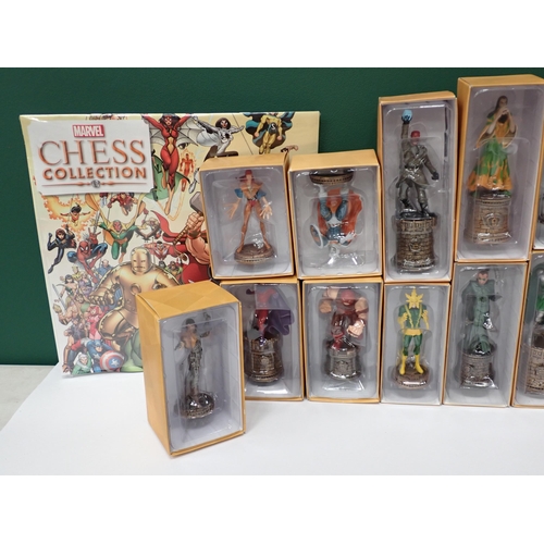 13 - Twenty one boxed Marvel Collector's Figures and a Marvel Chess Collection Calendar