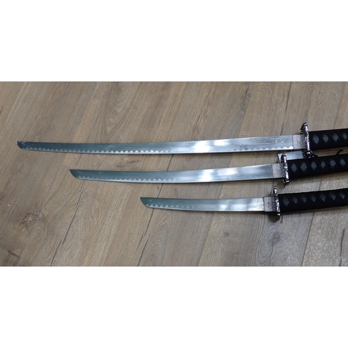 198 - Three reproduction Samurai Swords