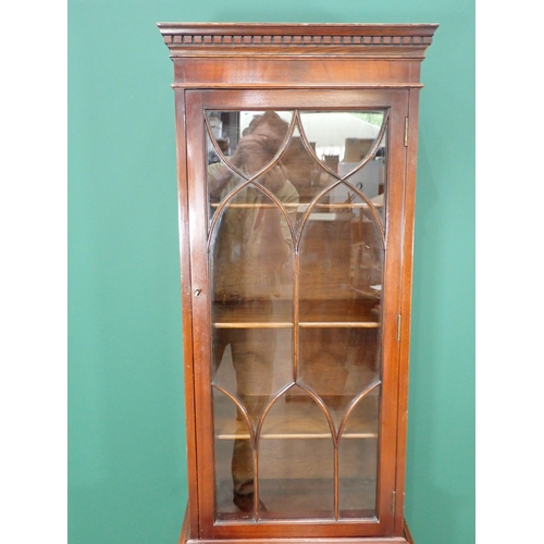 205 - A mahogany veneered narrow Bookcase fitted glazed door above base with single drawer and pair of cup... 