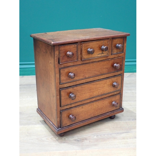 208 - A 19th Century fruitwood Apprentice Piece Chest of three short above three long drawers mounted on b... 