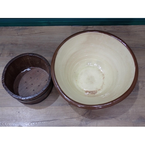 212 - A cream and brown glazed Dairy Bowl and a coopered oak Planter