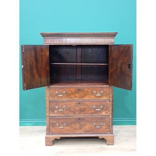 216 - A mahogany veneered Georgian style two door Cupboard fitted three drawers to base mounted on ogee br... 