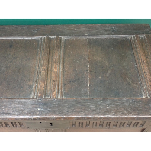 242 - A small late 17th Century oak Coffer with sunken two panel lid above nulled frieze and plain two pan... 