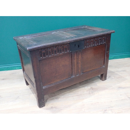 242 - A small late 17th Century oak Coffer with sunken two panel lid above nulled frieze and plain two pan... 