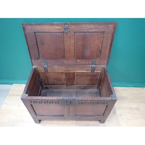 242 - A small late 17th Century oak Coffer with sunken two panel lid above nulled frieze and plain two pan... 