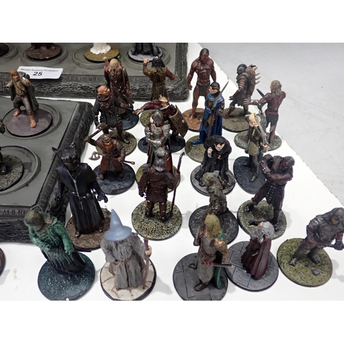 25 - A quantity of unboxed Lord of the Rings Figures, Stands and Collector's Manuals