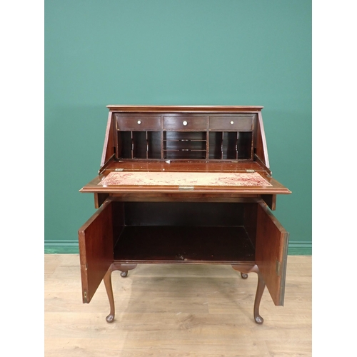 295 - An Edwardian mahogany and strung Bureau fitted single drawer above pair of cupboard doors mounted on... 