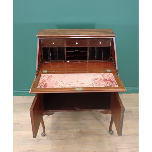 295 - An Edwardian mahogany and strung Bureau fitted single drawer above pair of cupboard doors mounted on... 