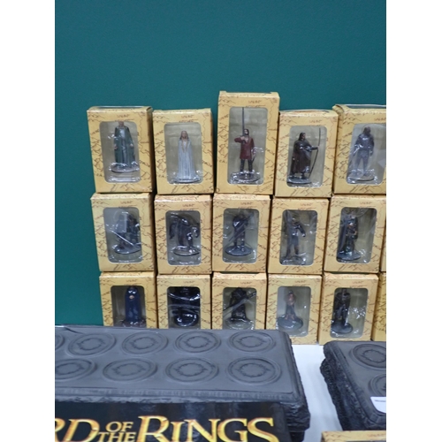 30 - Thirty boxed Lord of the Rings Figures, six display stands and two Collector Model Books.