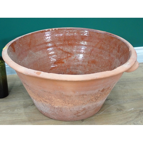 317 - A large Dairy Bowl and a quantity of antique glass Bottles