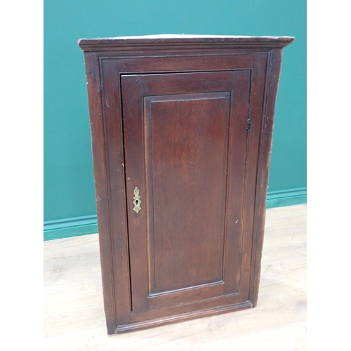 322 - An 18th Century oak hanging Corner Cupboard fitted single fielded panel door 3ft 3in H x 2ft 1in W