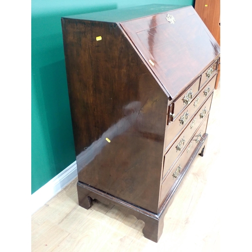 324 - A George III mahogany Bureau with fall front enclosing secret drawers, pigeon holes and inlaid drawe... 