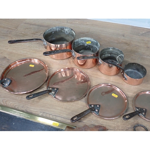 336 - A set of four antique graduated Cooking Pots and Lids, two sets of Scales and a Saw