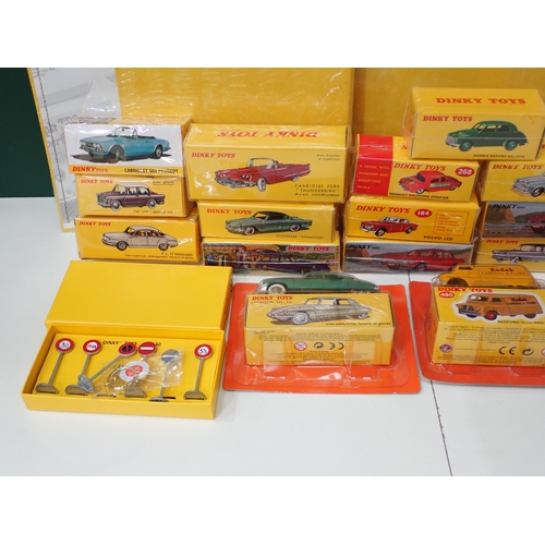 34 - Twenty boxed Atlas Models Dinky Toys, three Folders, two Badges and a collection of Classic Dinky To... 